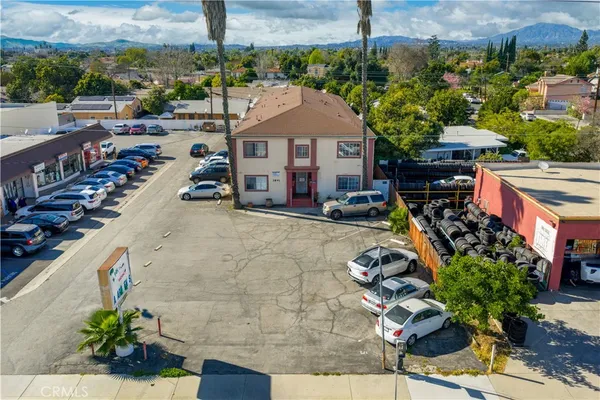 a aerial view of a house with a garden and balcony