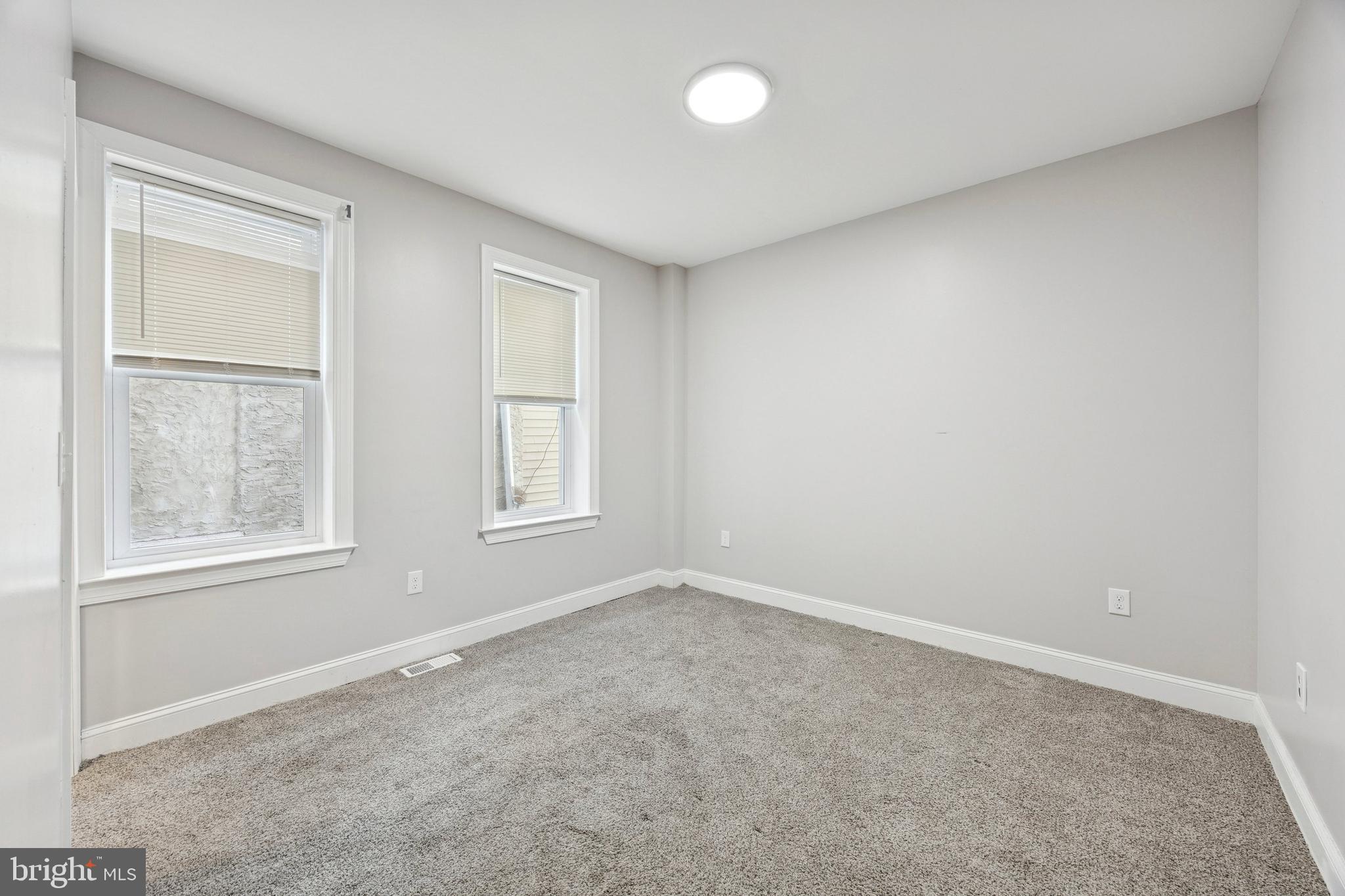 4602 Longshore Avenue Philadelphia, PA 19135 - Photo 13 of 16 an empty room with windows