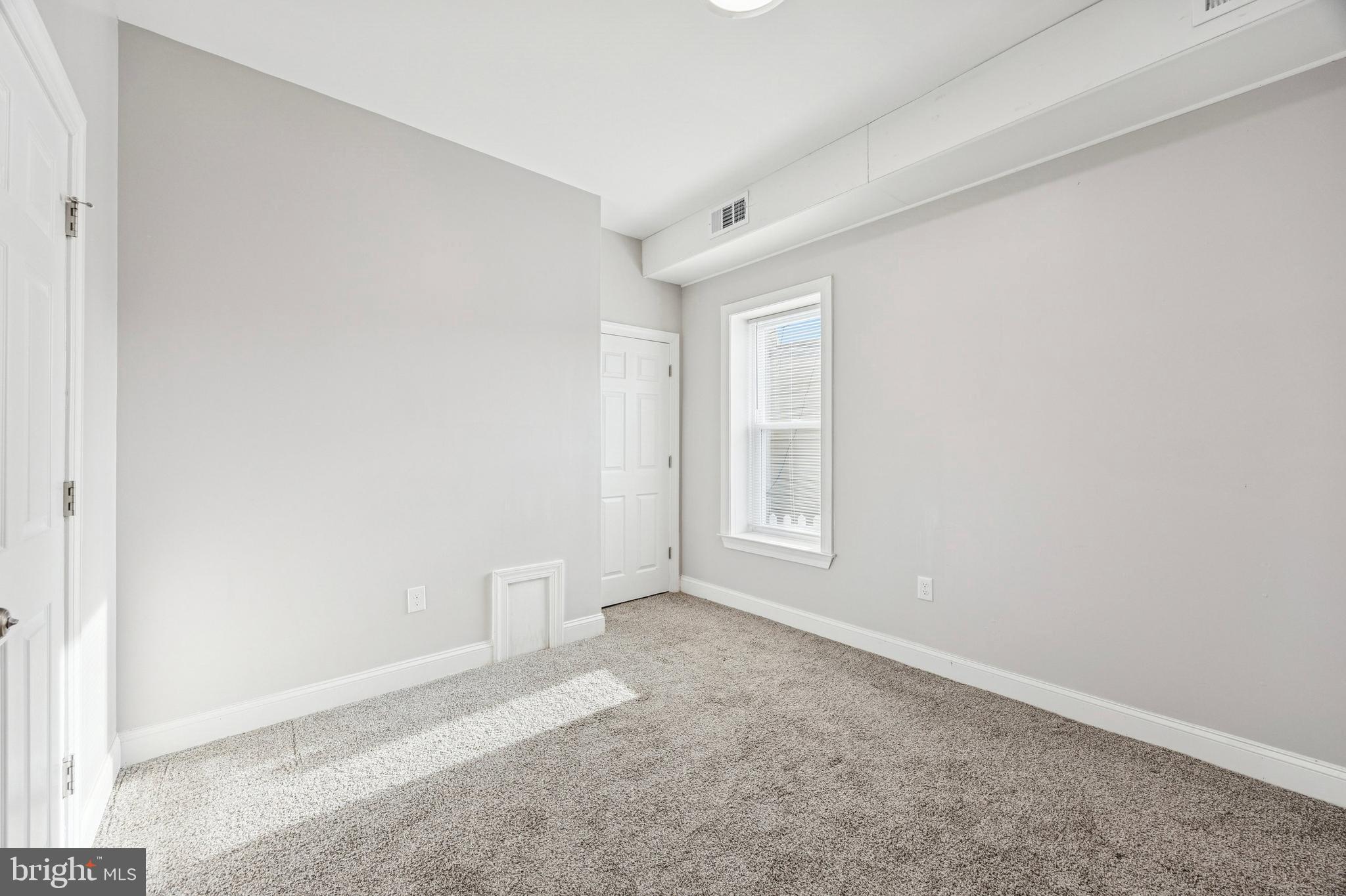 4602 Longshore Avenue Philadelphia, PA 19135 - Photo 14 of 16 a view of an empty room with a window