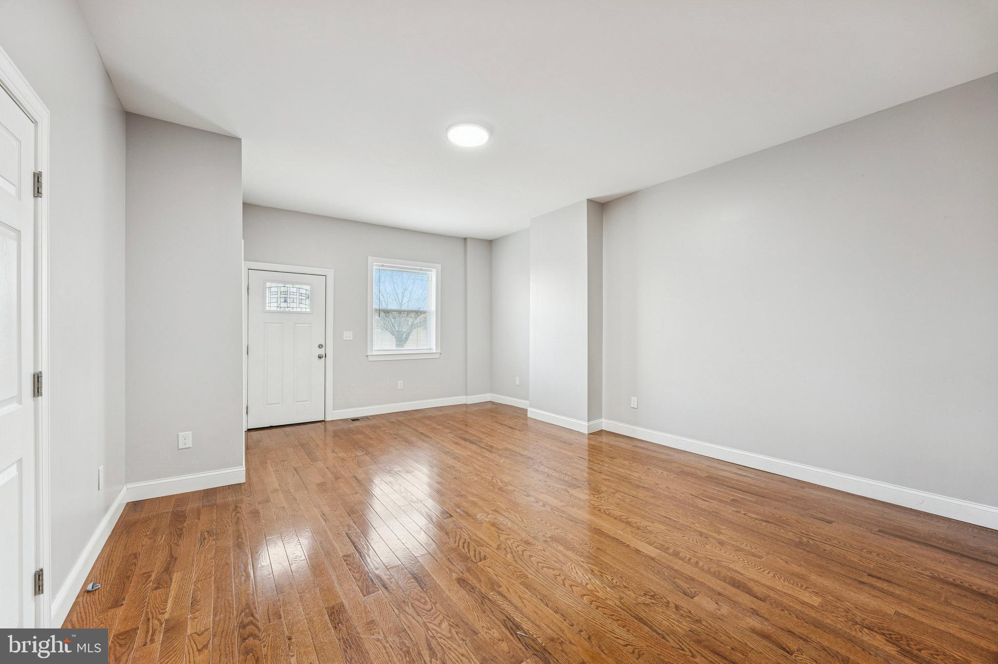 4602 Longshore Avenue Philadelphia, PA 19135 - Photo 5 of 16 a view of an empty room with wooden floor and closet