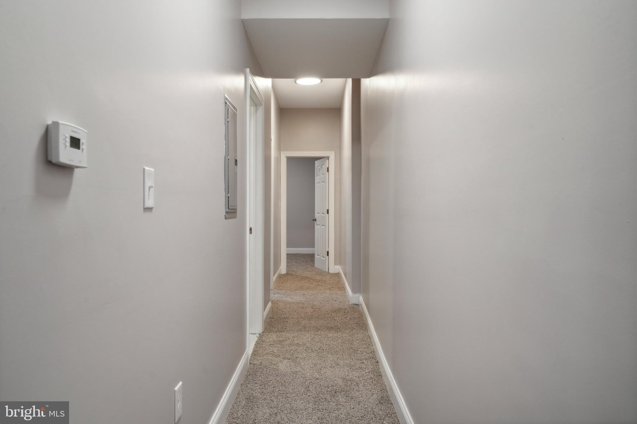 4602 Longshore Avenue Philadelphia, PA 19135 - Photo 9 of 16 a view of a hallway with wooden floor