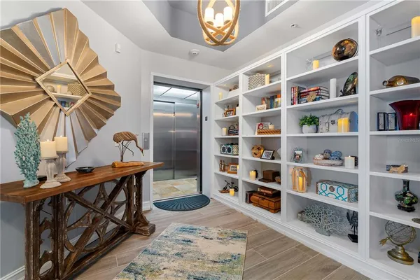 a kitchen with kitchen island a sink refrigerator and microwave
