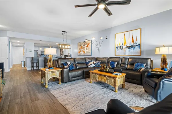 a view of a living room and a wooden floor