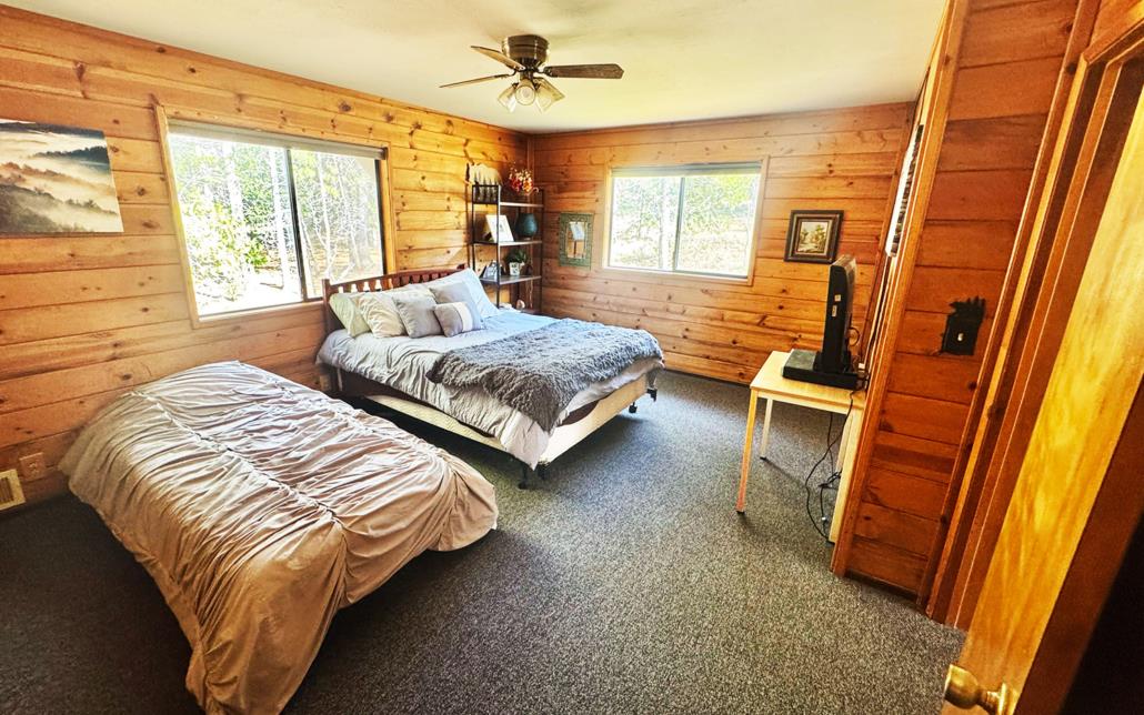 6330 Caldor Road Somerset, CA 95684 - Photo 14 of 30 a bedroom with two beds and large window