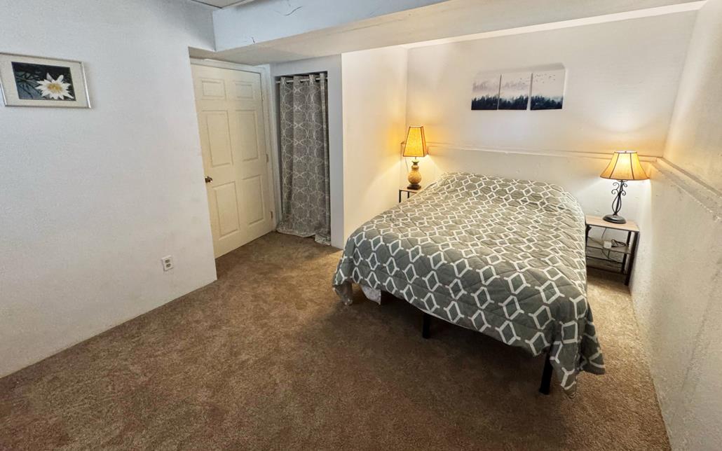 6330 Caldor Road Somerset, CA 95684 - Photo 19 of 30 a bedroom with a bed and a night stand