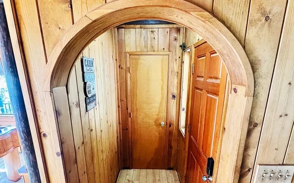 a bedroom with furniture and a flat screen tv