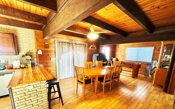 a kitchen with stainless steel appliances wooden cabinets a sink and a stove