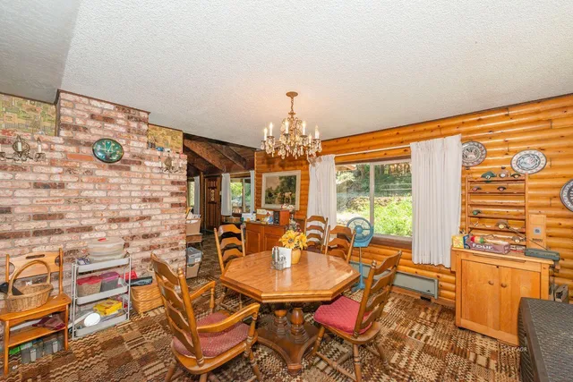 a dining room with furniture and window