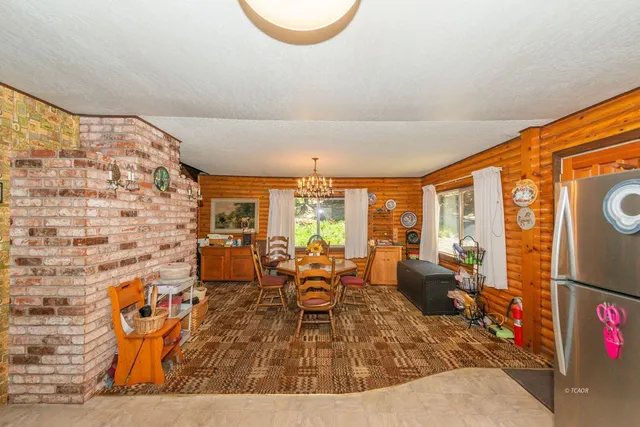 view of living room with furniture and floor to ceiling window