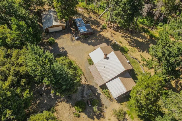an aerial view of residential house with outdoor space