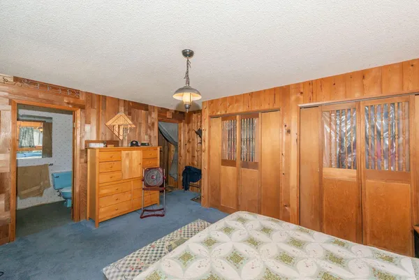 a bed room with a bed and a window