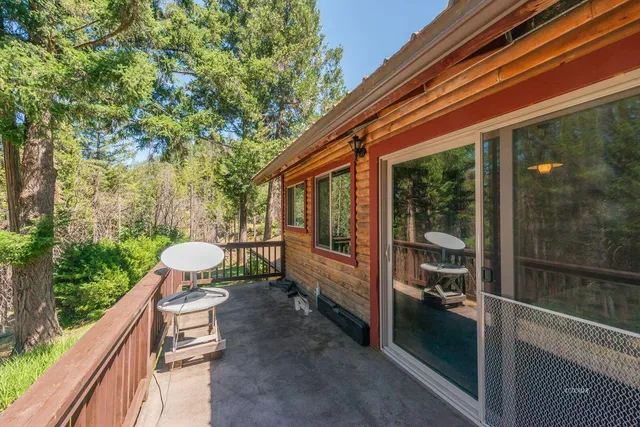 a view of a house with a yard porch and sitting area