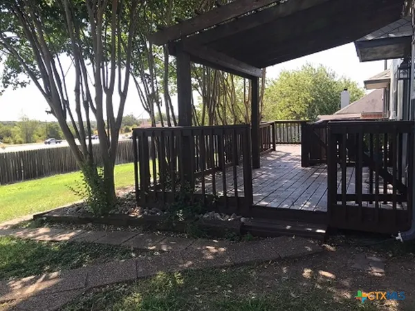 a view of a patio with a yard