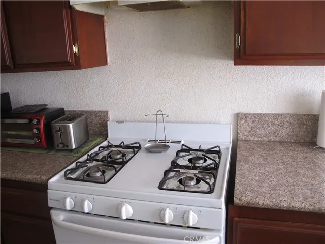 a kitchen with a stove and a microwave