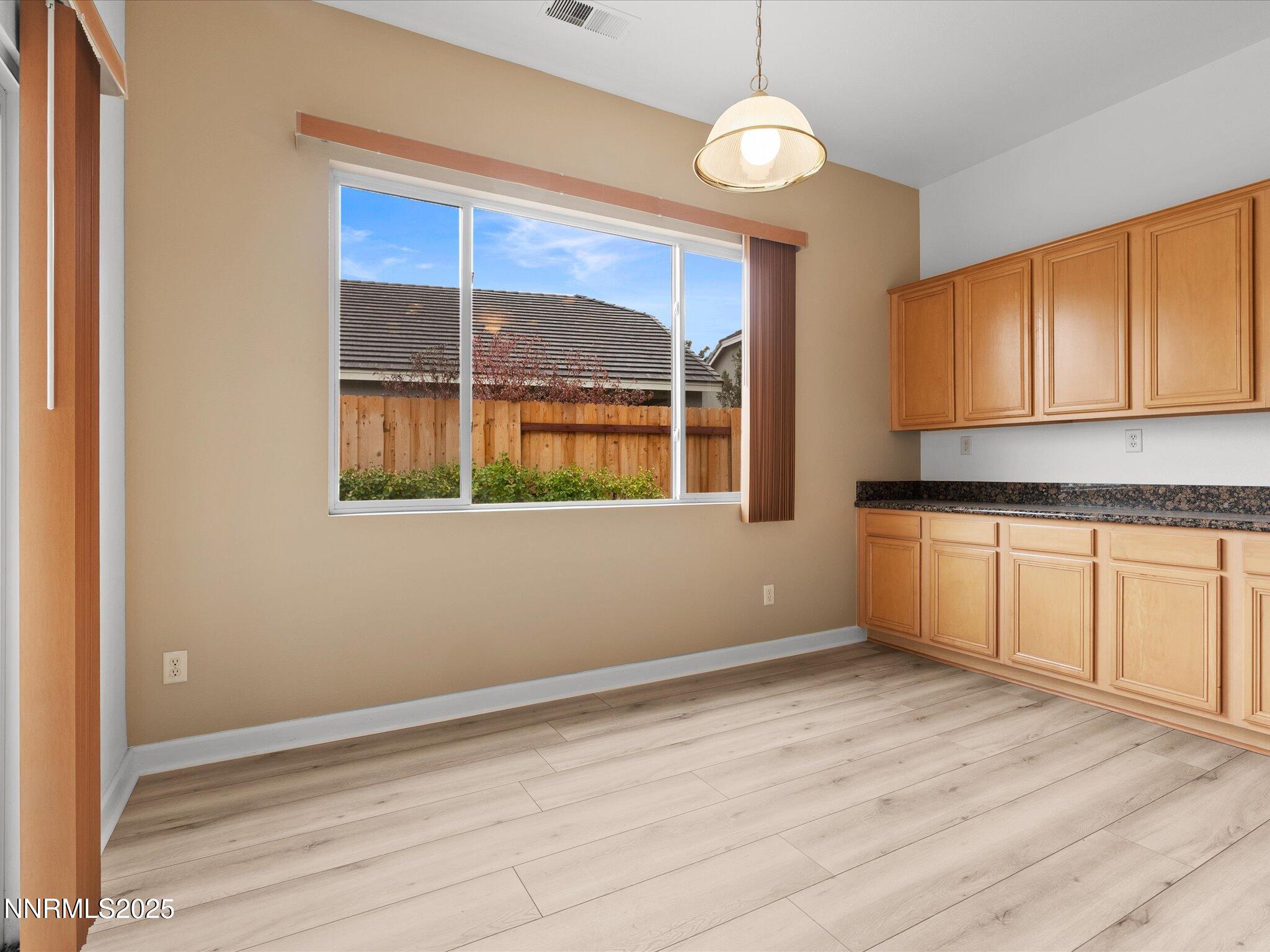 10316 Sterling View Court Reno, NV 89521 - Photo 13 of 41 a view of empty room with wooden floor and fan