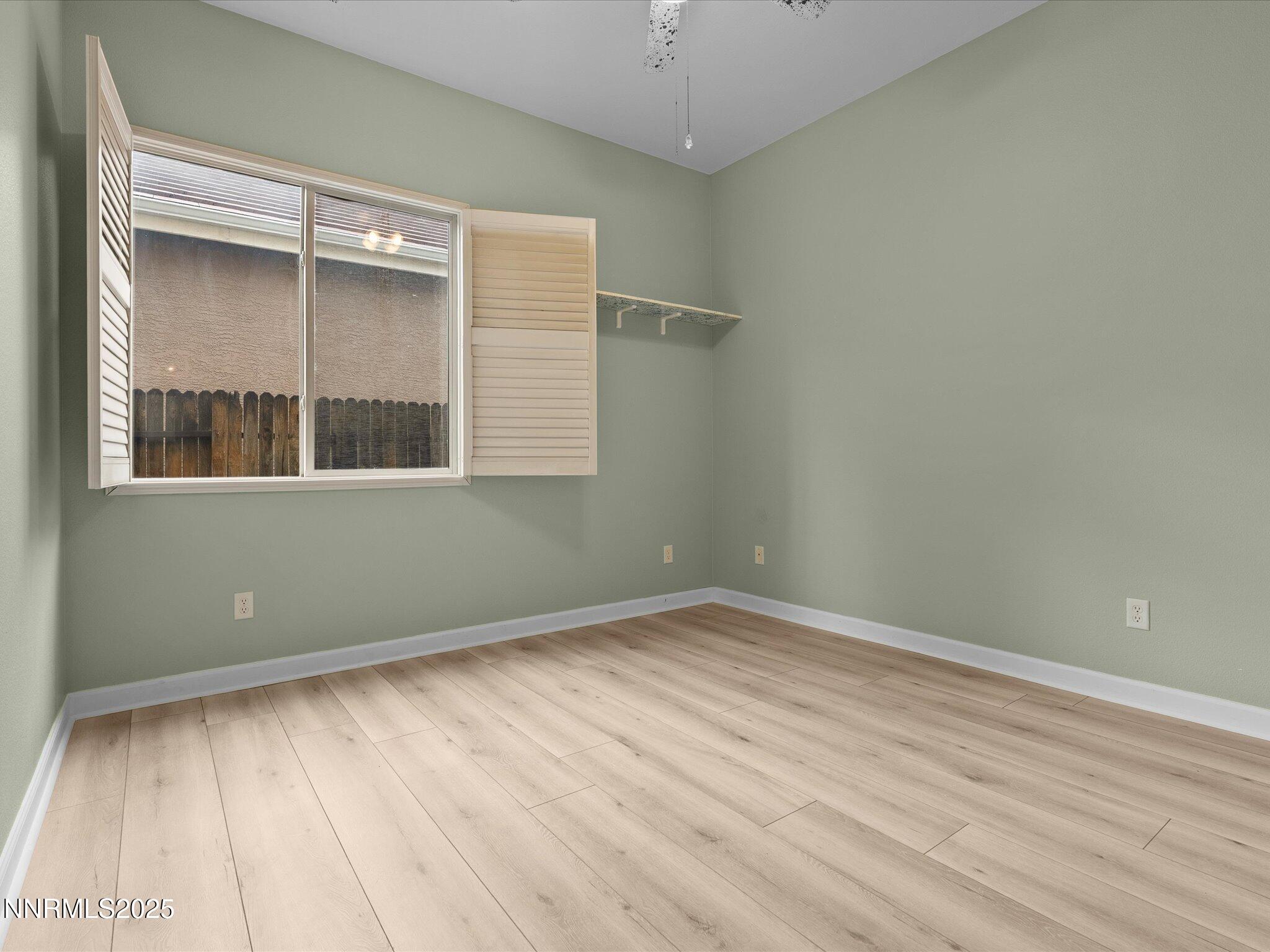 10316 Sterling View Court Reno, NV 89521 - Photo 26 of 41 an empty room with wooden floor and windows