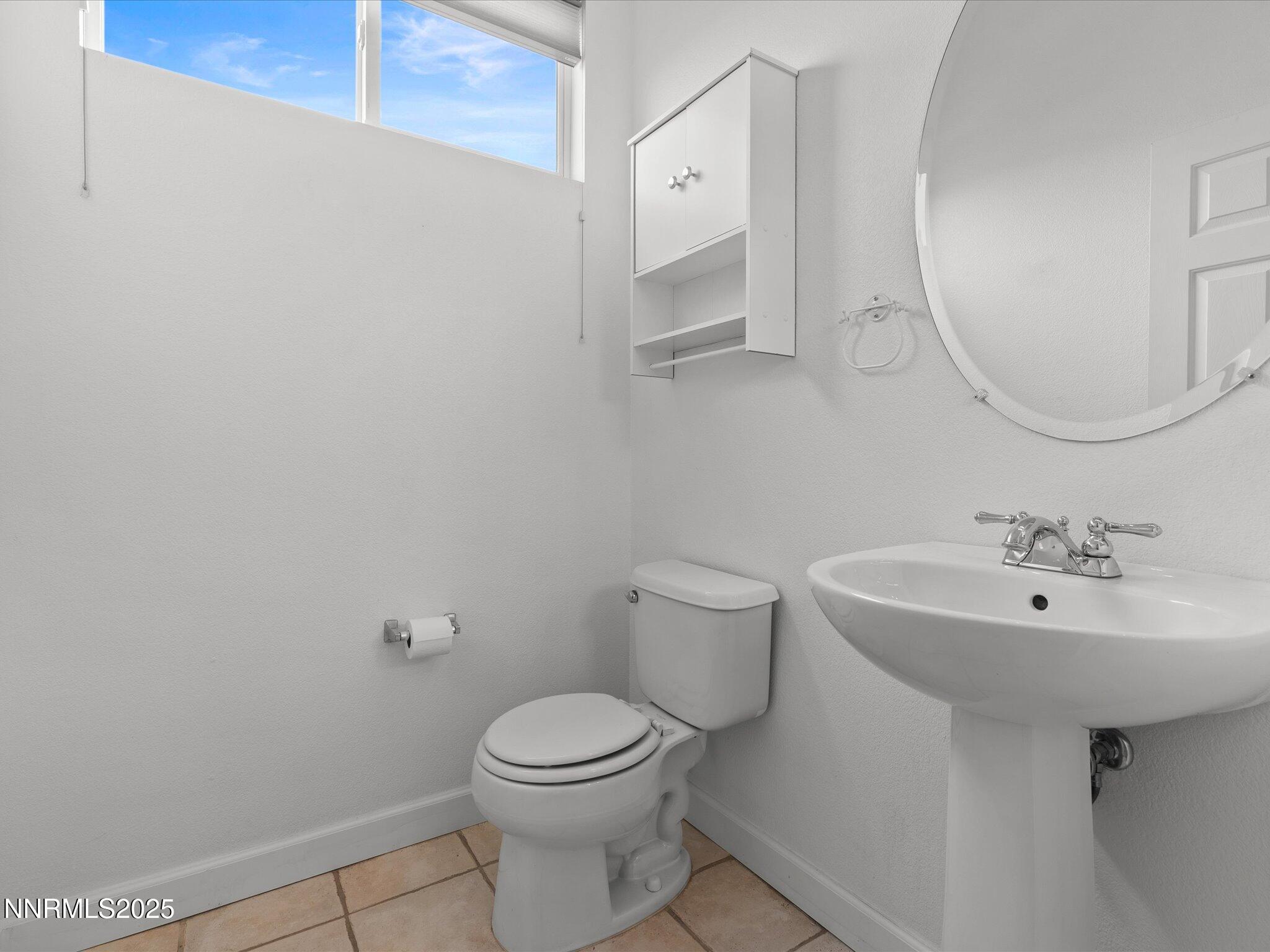 10316 Sterling View Court Reno, NV 89521 - Photo 28 of 41 a bathroom with a sink a toilet and mirror