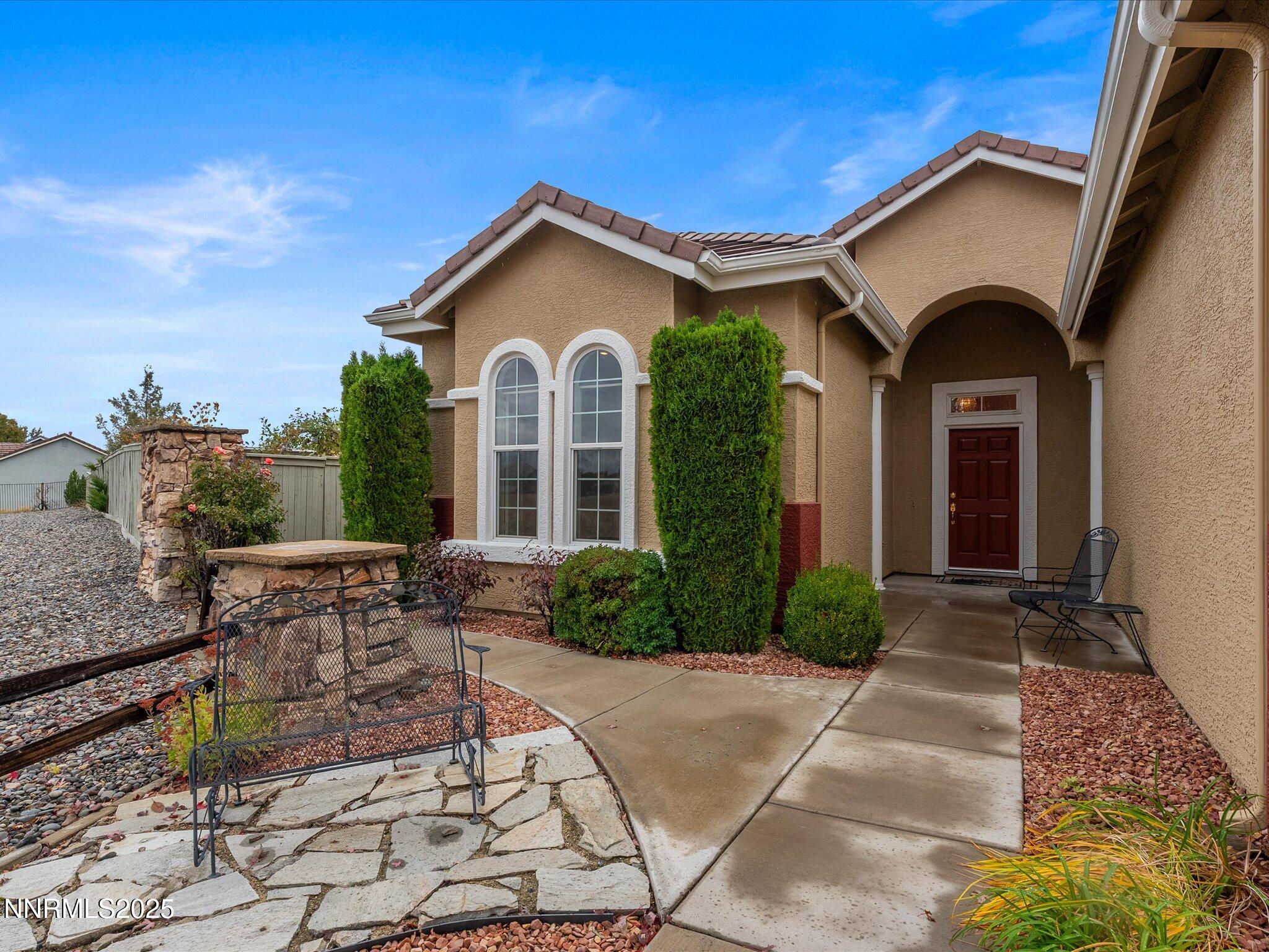 10316 Sterling View Court Reno, NV 89521 - Photo 3 of 41 a front view of a house with garden
