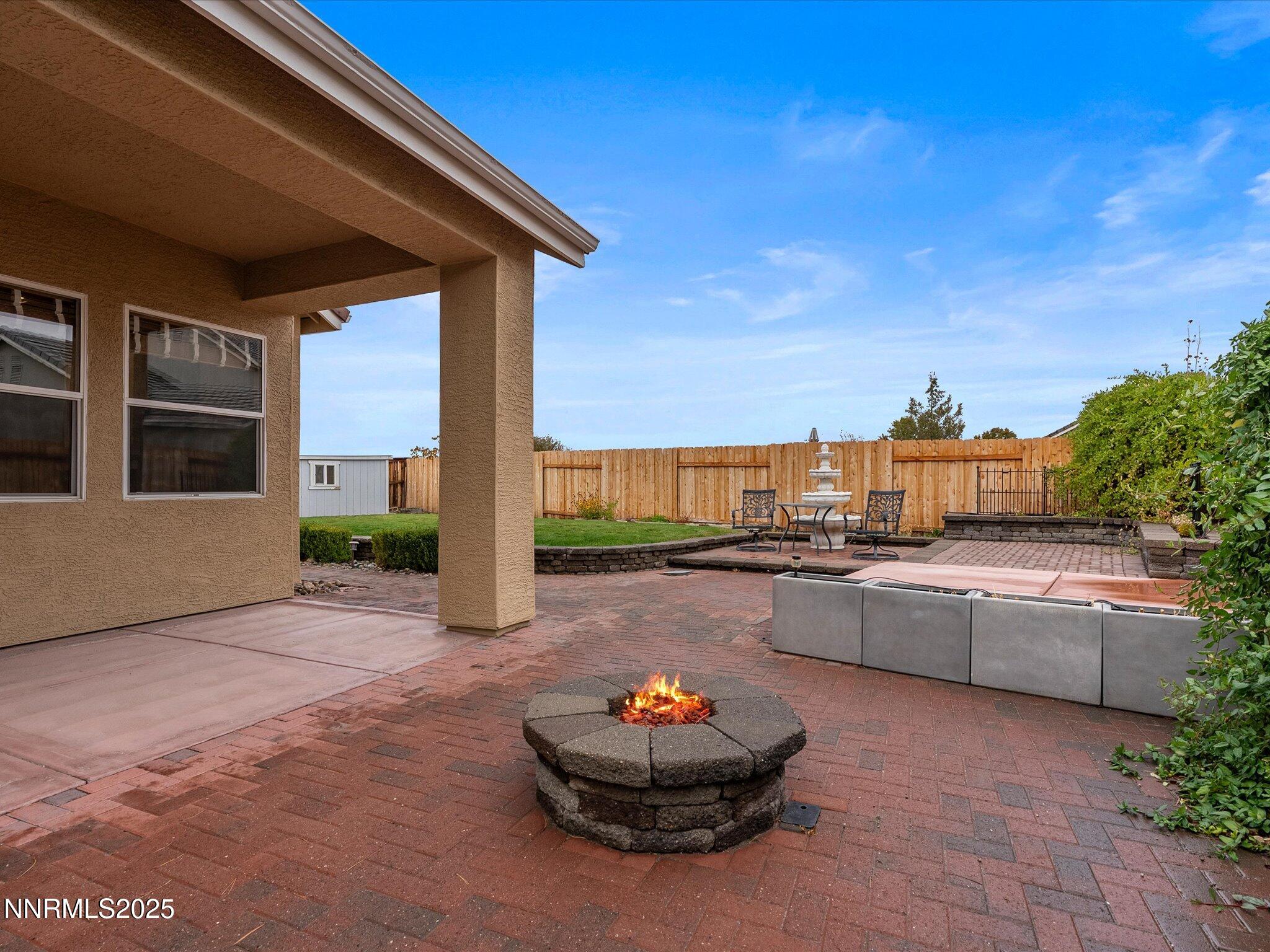10316 Sterling View Court Reno, NV 89521 - Photo 31 of 41 a living room with furniture a flat screen tv and outdoor seating