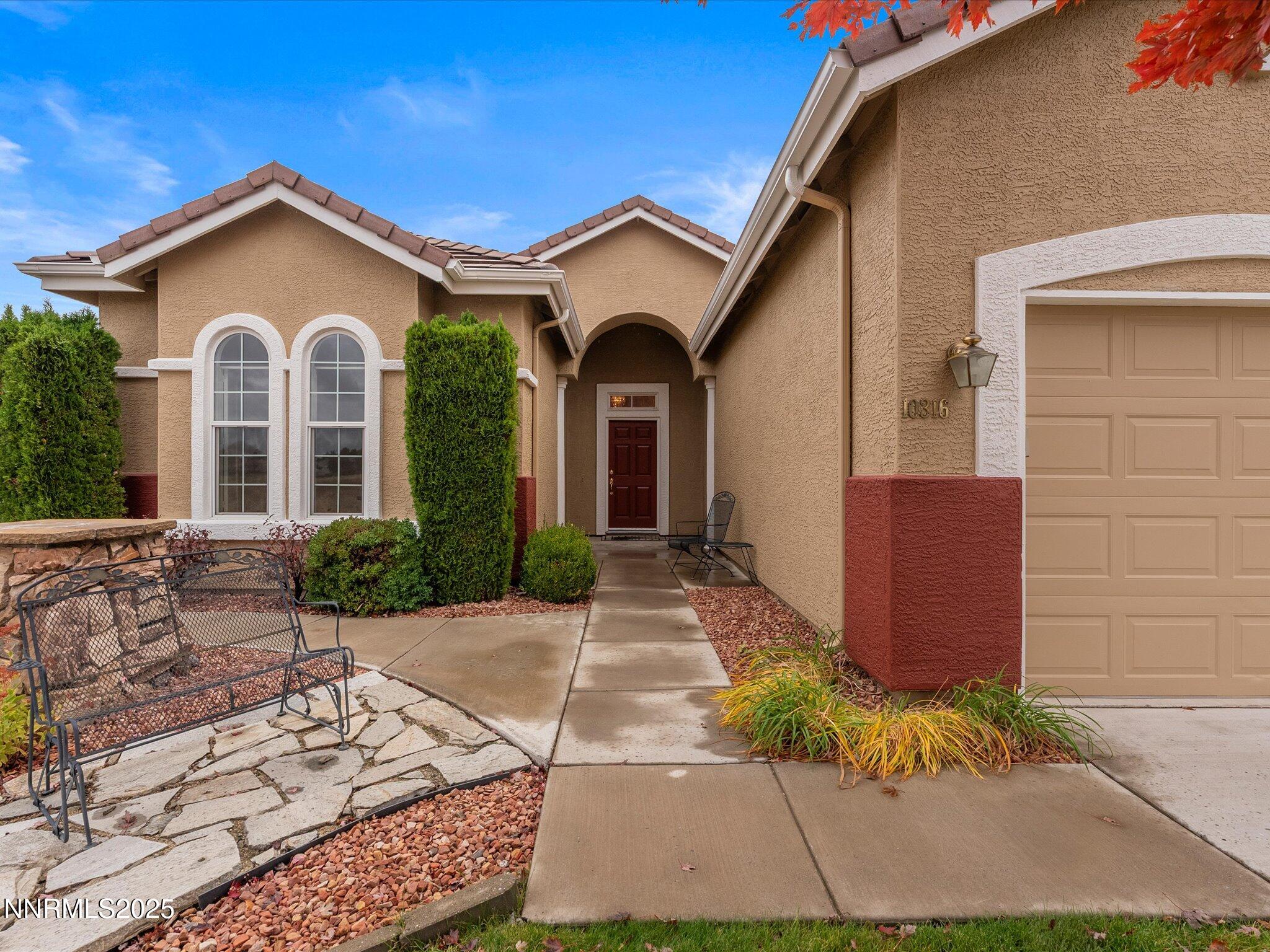 10316 Sterling View Court Reno, NV 89521 - Photo 4 of 41 a front view of a house with garden
