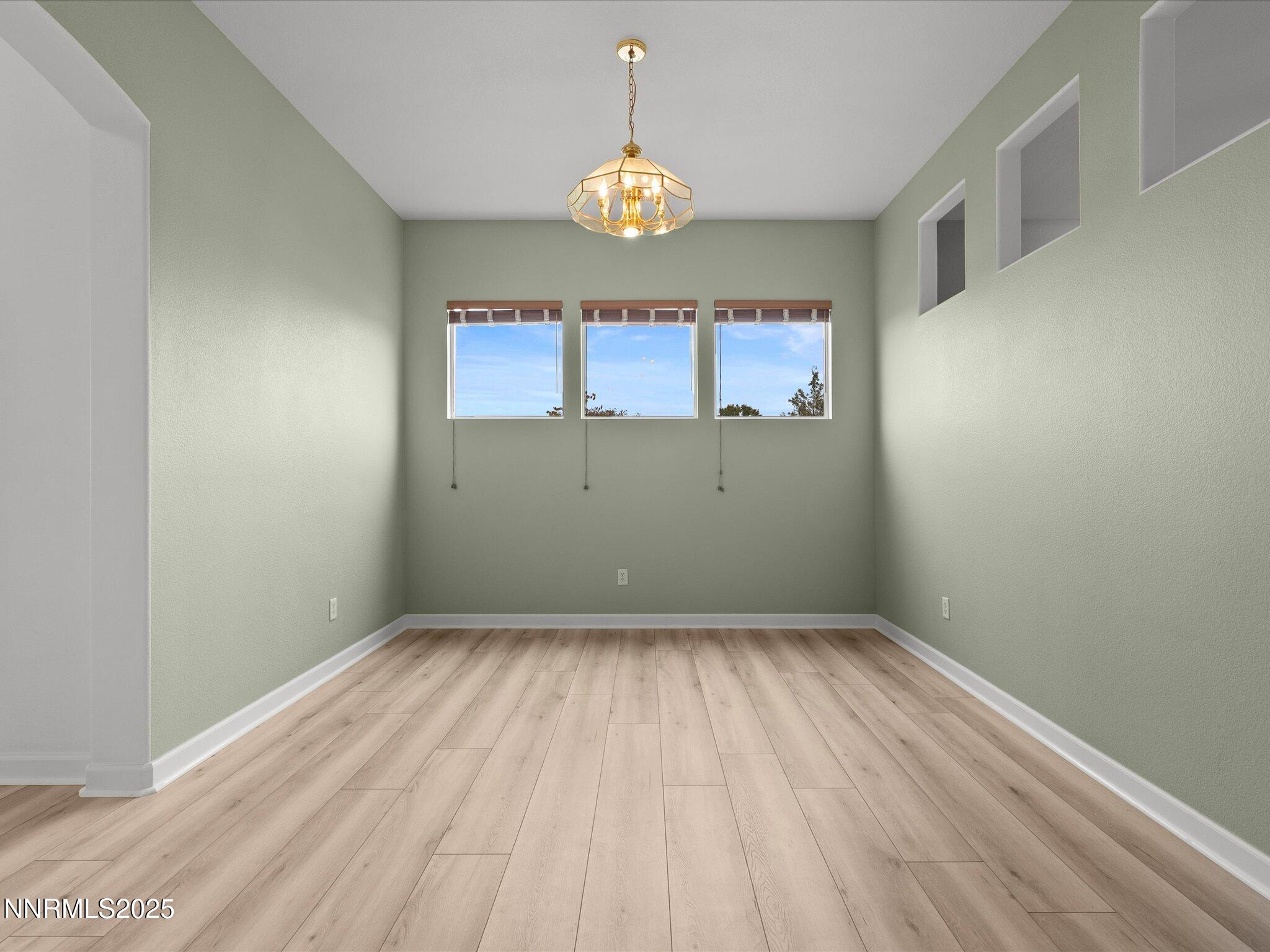 10316 Sterling View Court Reno, NV 89521 - Photo 7 of 41 a view of empty room with wooden floor