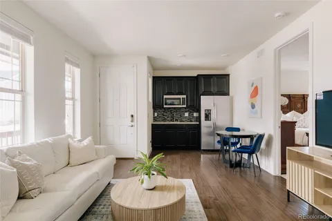 a bedroom with a large bed and a chair