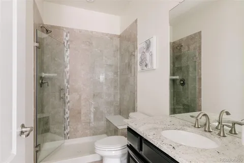 a living room with a bed furniture and a large window