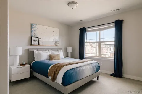 a bathroom with a granite countertop sink toilet a mirror and shower