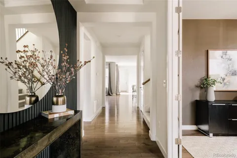 a view of a hallway view with wooden floor and staircase