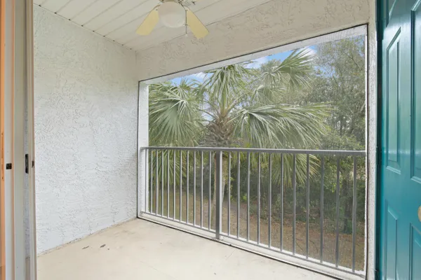 a view of a glass door with a balcony