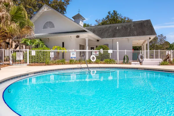 a view of house with a swimming pool