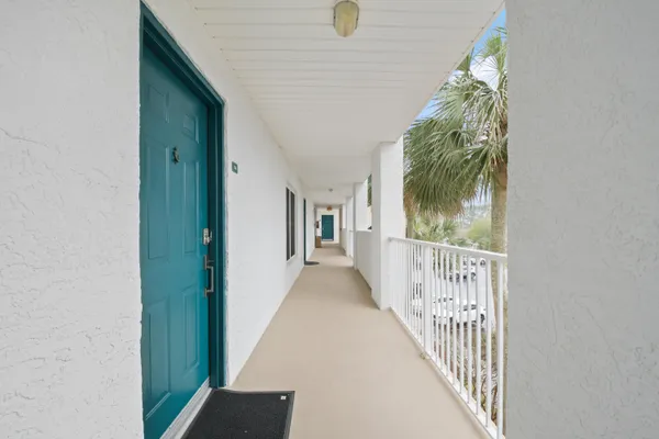 a view of a hallway view with staircase