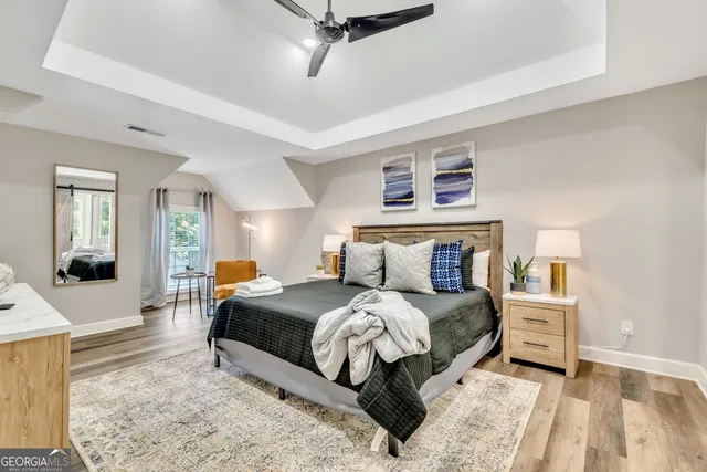 a bedroom with a bed and a couch