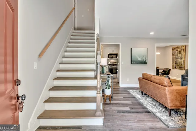 a living room with furniture and a painting