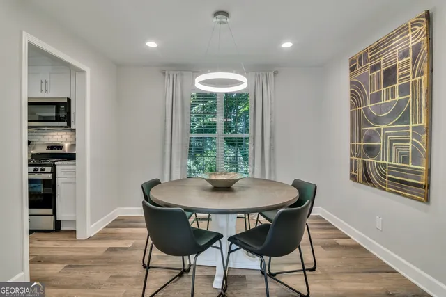 a dining room with furniture and window