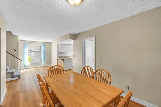a kitchen with stainless steel appliances granite countertop a stove and a refrigerator