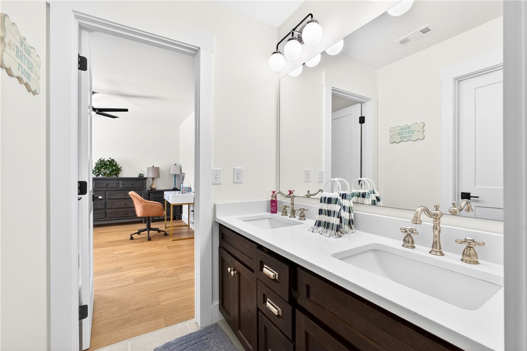 5016 Copeland Road Belton, SC 29627 - Photo 32 of 45 Double vanity with sleek white countertops and ample storage offers a perfect blend of form and function.