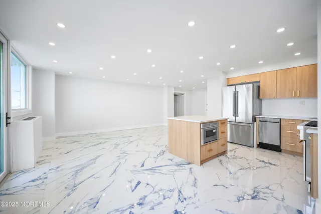 a bathroom with a sink vanity and toilet