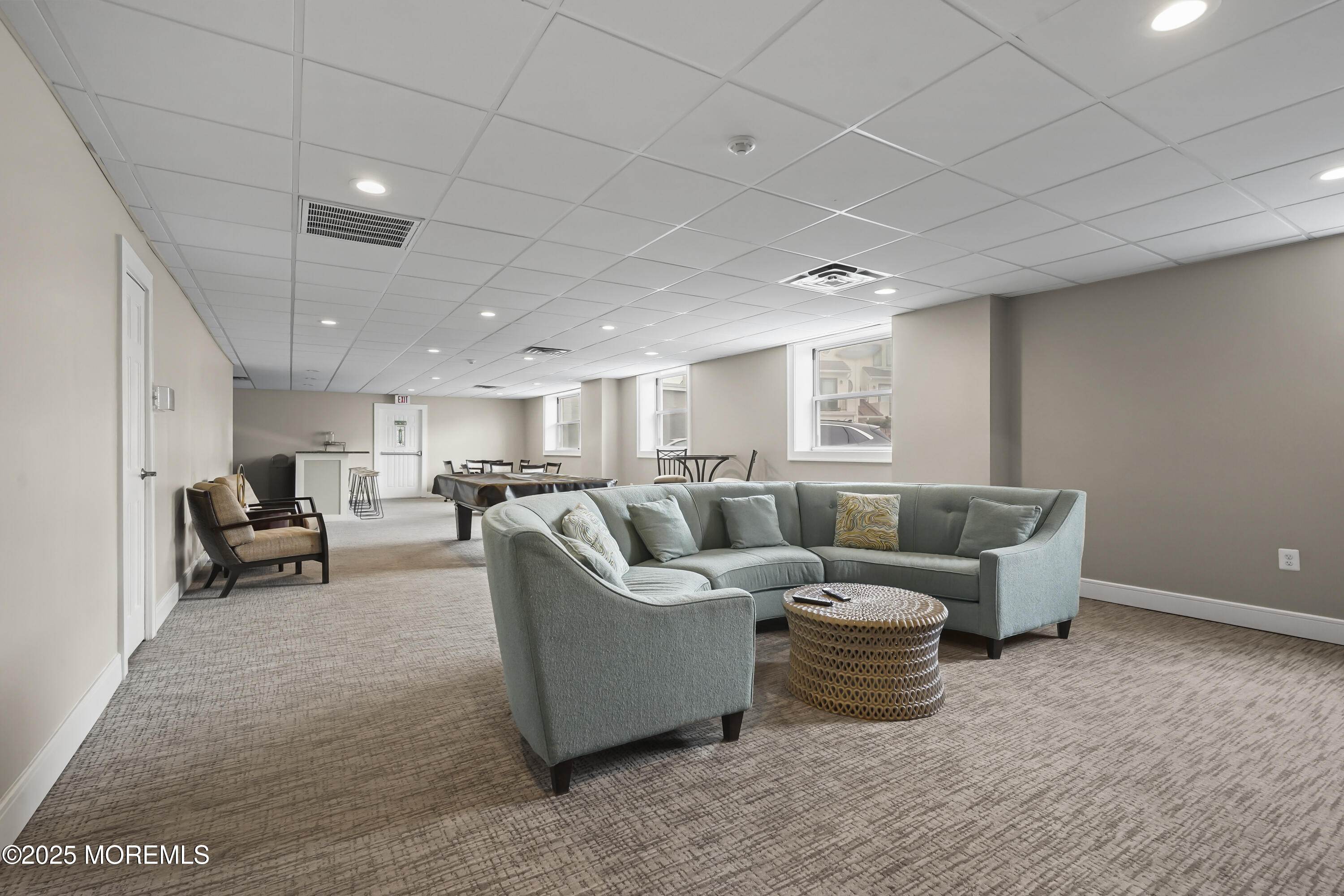 675 Ocean Avenue, Unit 9F Long Branch, NJ 07740 - Photo 11 of 31 a living room with furniture and a table