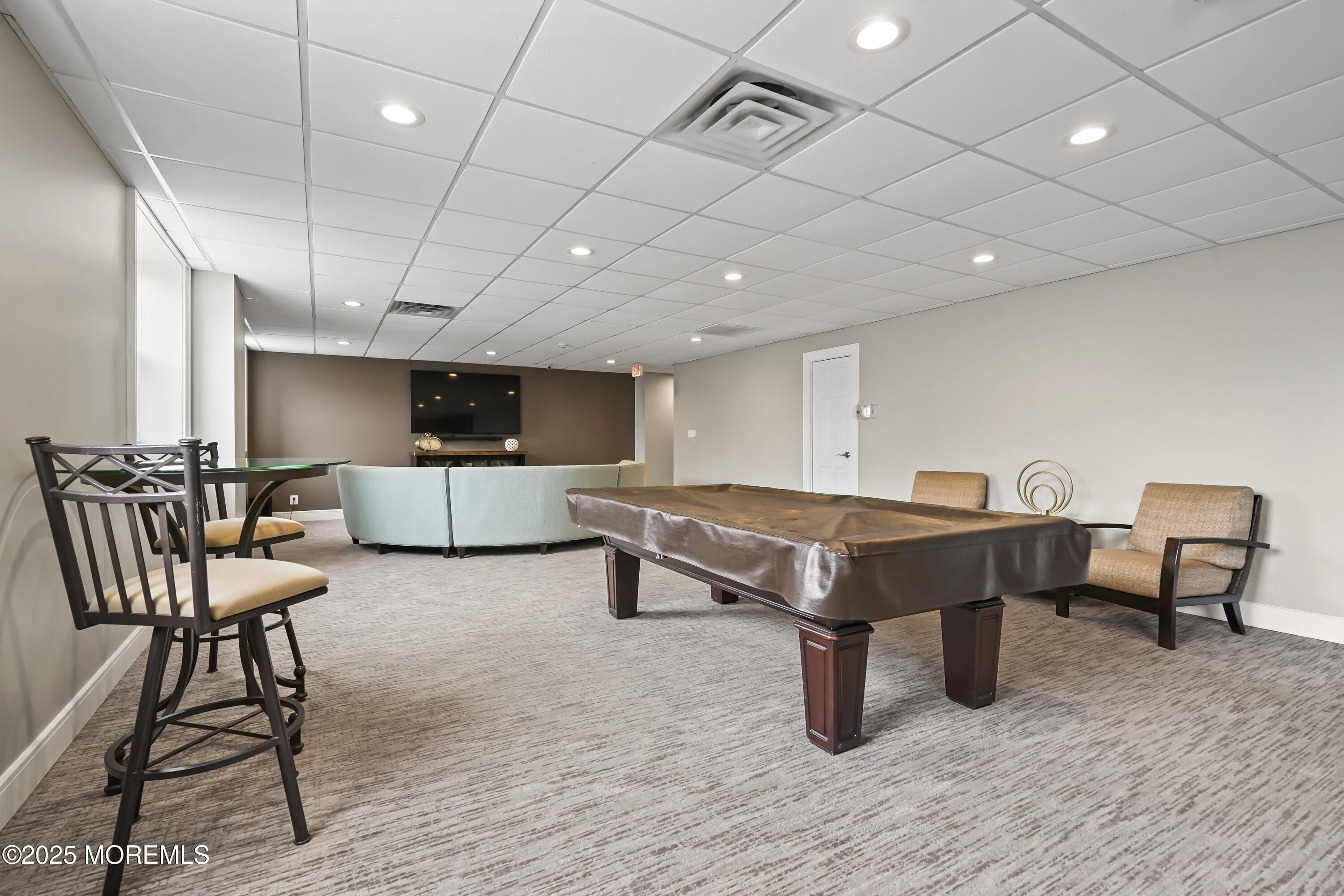 675 Ocean Avenue, Unit 9F Long Branch, NJ 07740 - Photo 12 of 31 a room with furniture and wooden floor