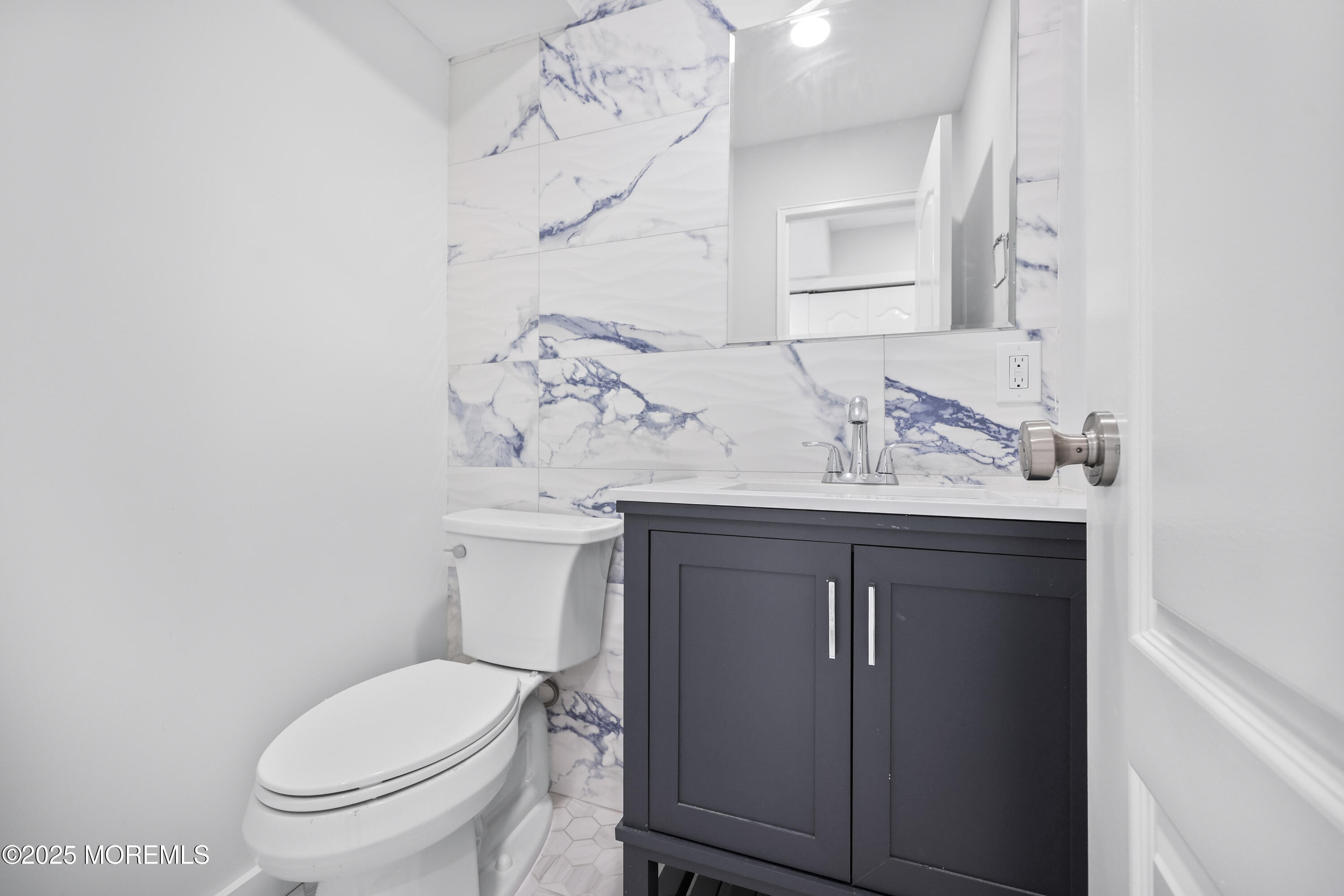 675 Ocean Avenue, Unit 9F Long Branch, NJ 07740 - Photo 12 of 31 a bathroom with a sink vanity and toilet