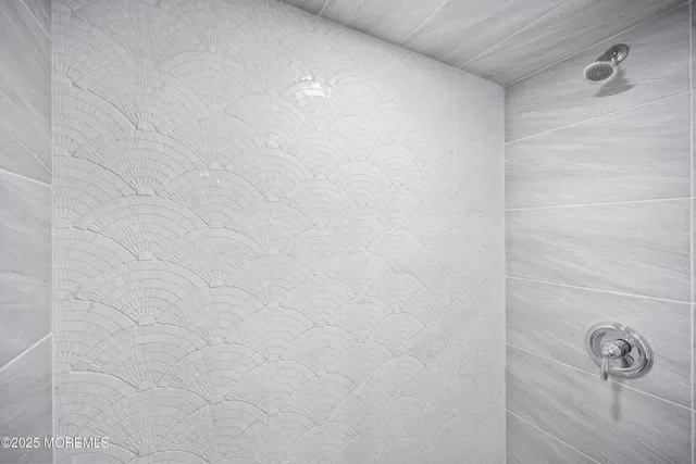 a view of a room with furniture and floor to ceiling window