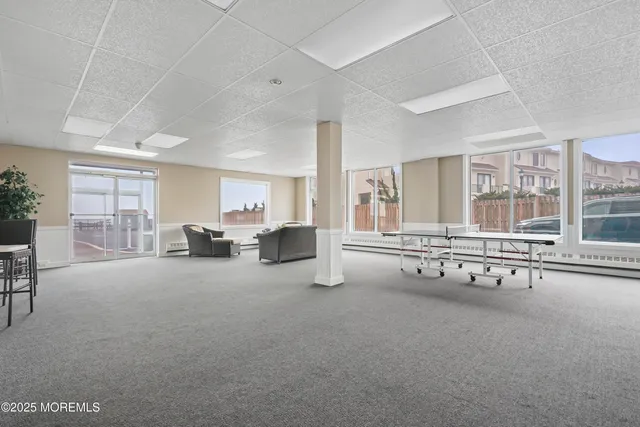 a view of a swimming pool with outdoor seating