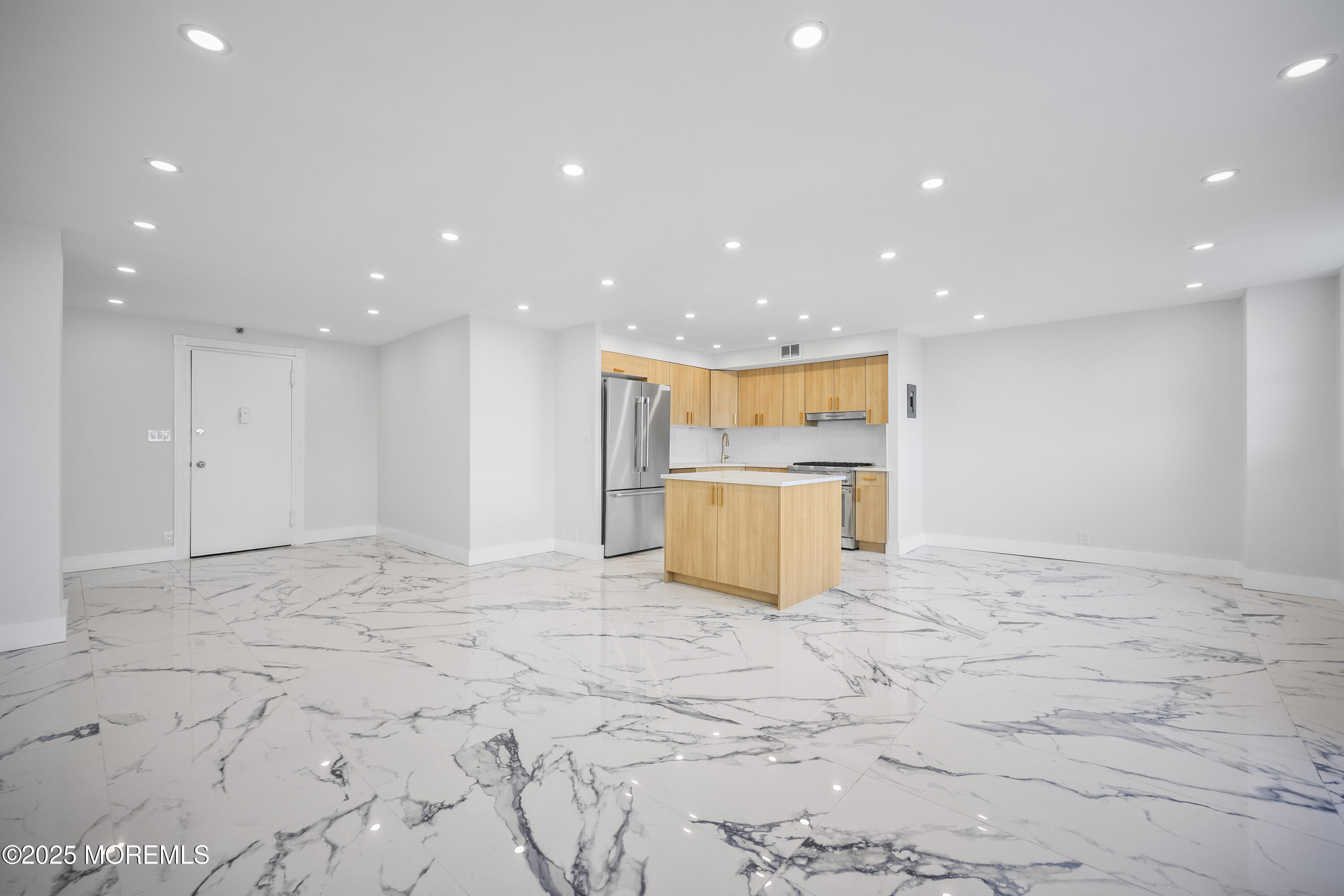 675 Ocean Avenue, Unit 9F Long Branch, NJ 07740 - Photo 23 of 31 a view of an empty room with a cabinet and a kitchen