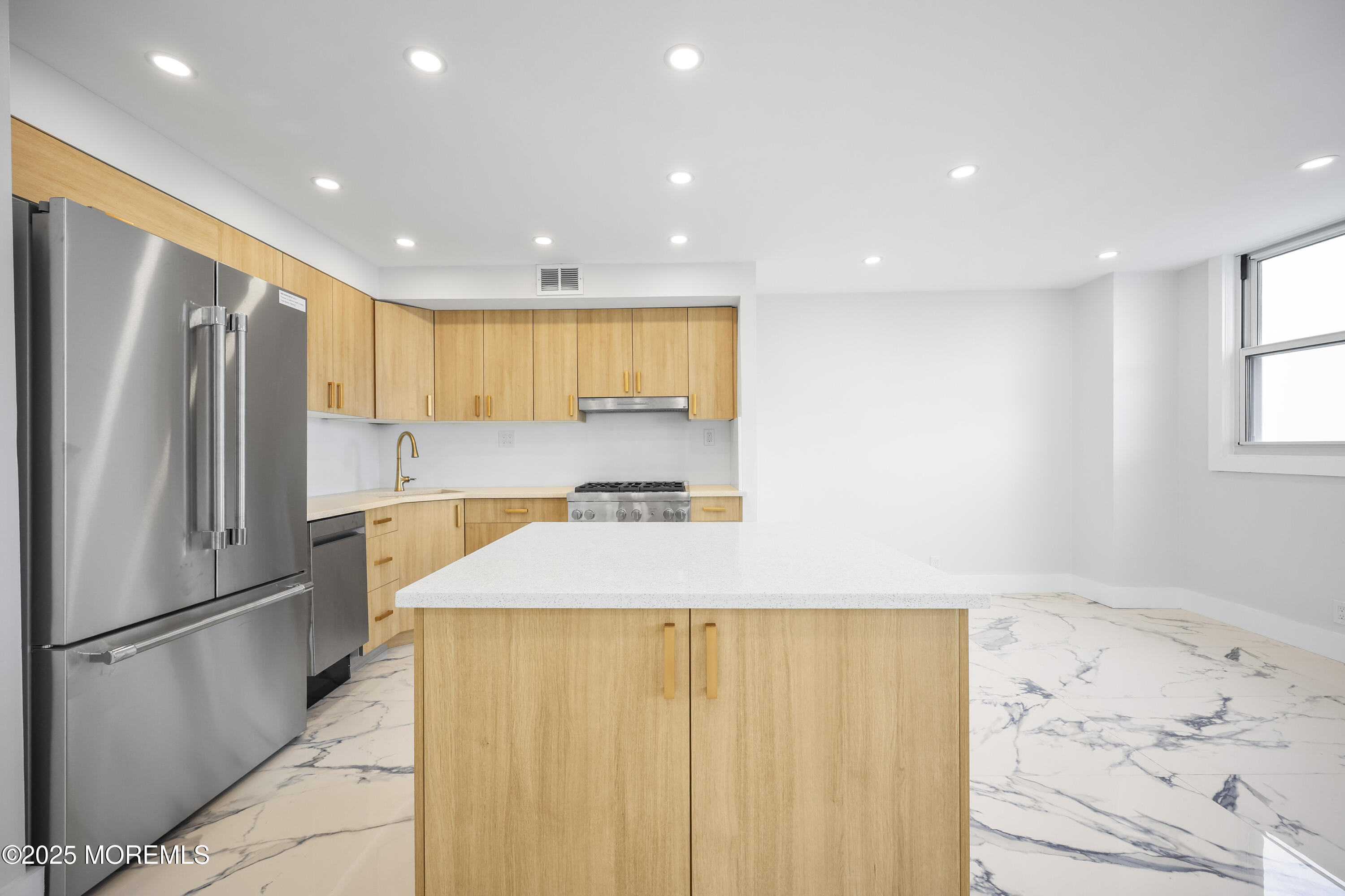 675 Ocean Avenue, Unit 9F Long Branch, NJ 07740 - Photo 8 of 31 a kitchen with refrigerator and window