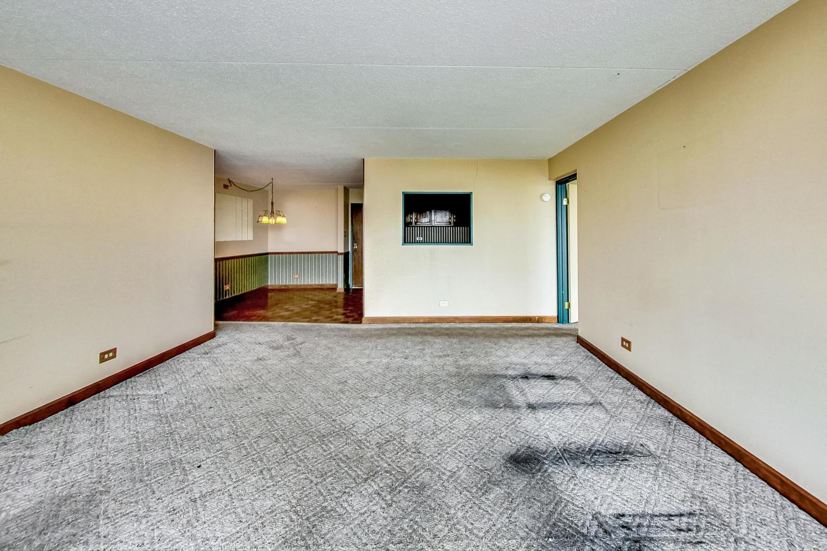 2005 South Finley Road, Unit 910 Lombard, IL 60148 - Photo 10 of 30 a view of a room with a fireplace