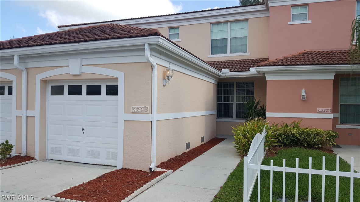 3829 Schoolhouse Road East, Unit 3 Fort Myers, FL 33916 - Photo 2 of 18 a front view of house with yard
