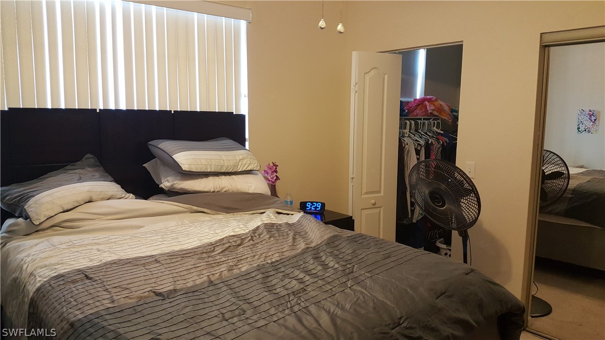 3829 Schoolhouse Road East, Unit 3 Fort Myers, FL 33916 - Photo 7 of 18 a bedroom with a bed and a closet