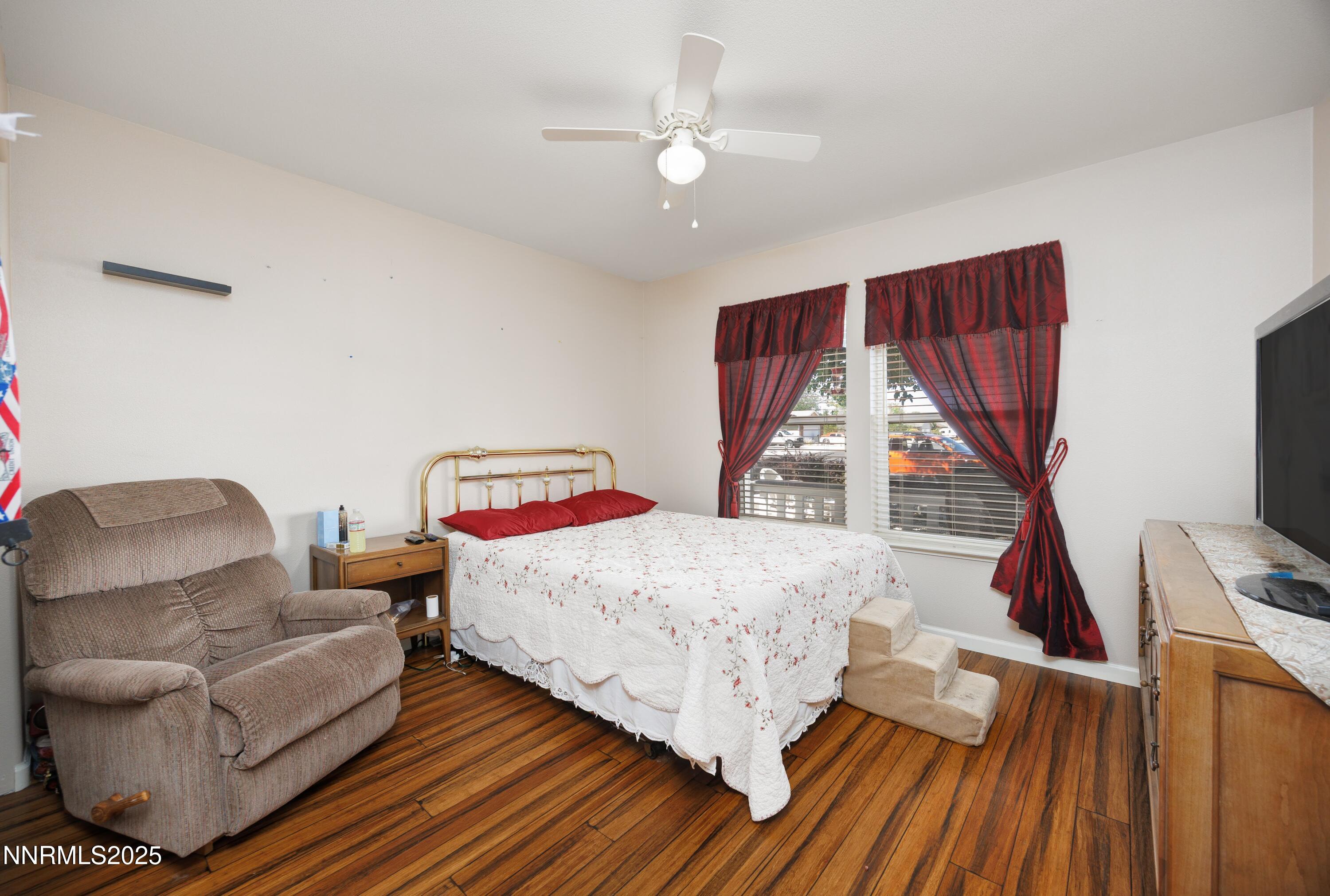 714 Noel Lane Fallon, NV 89406 - Photo 12 of 21 a bedroom with a bed couch and a window