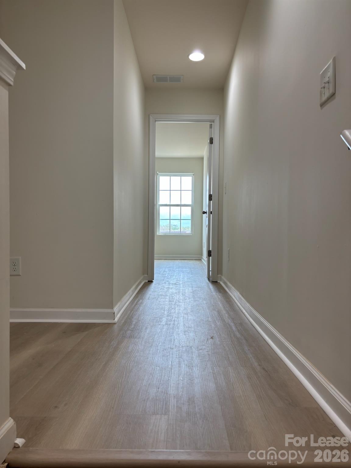 17924 Ragtop Day Lane Cornelius, NC 28031 - Photo 27 of 47 a view of a hallway with wooden floor
